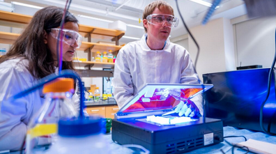 Dr. Jonathan Chekan with a student in a UNCG lab